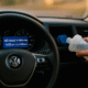 Driver topping up AdBlue while dashboard shows “No start in 500 miles” countdown