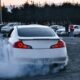 a white car with a lot of smoke coming out of it