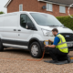 Mobile technician diagnosing a Ford Transit EcoBlue van on a driveway to resolve a SID212EVO AdBlue no-start countdown fault