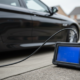 Close-up of OBD scanner plugged into a BMW diesel estate for fault code reading