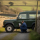 Land Rover Defender parked on a rural lane during mobile AdBlue diagnostics
