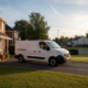 Nissan NV400 van parked on a suburban driveway with AdBlue warning active