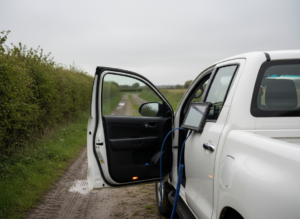 Toyota Hilux pickup on a farm track during mobile AdBlue diagnostic inspection