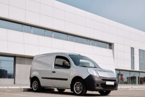 AdBlue fleet management - an unbranded white panel van parked outside a commercial building