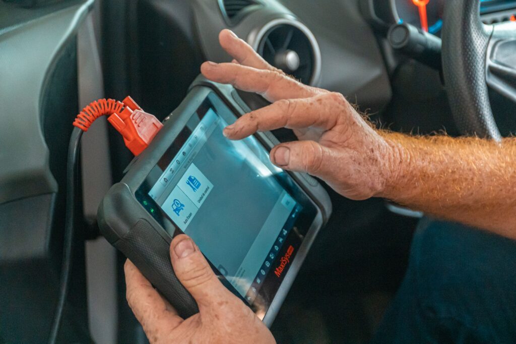 P2BAD Peugeot fault code diagnosis using a handheld scan tool plugged into a vehicle OBD port